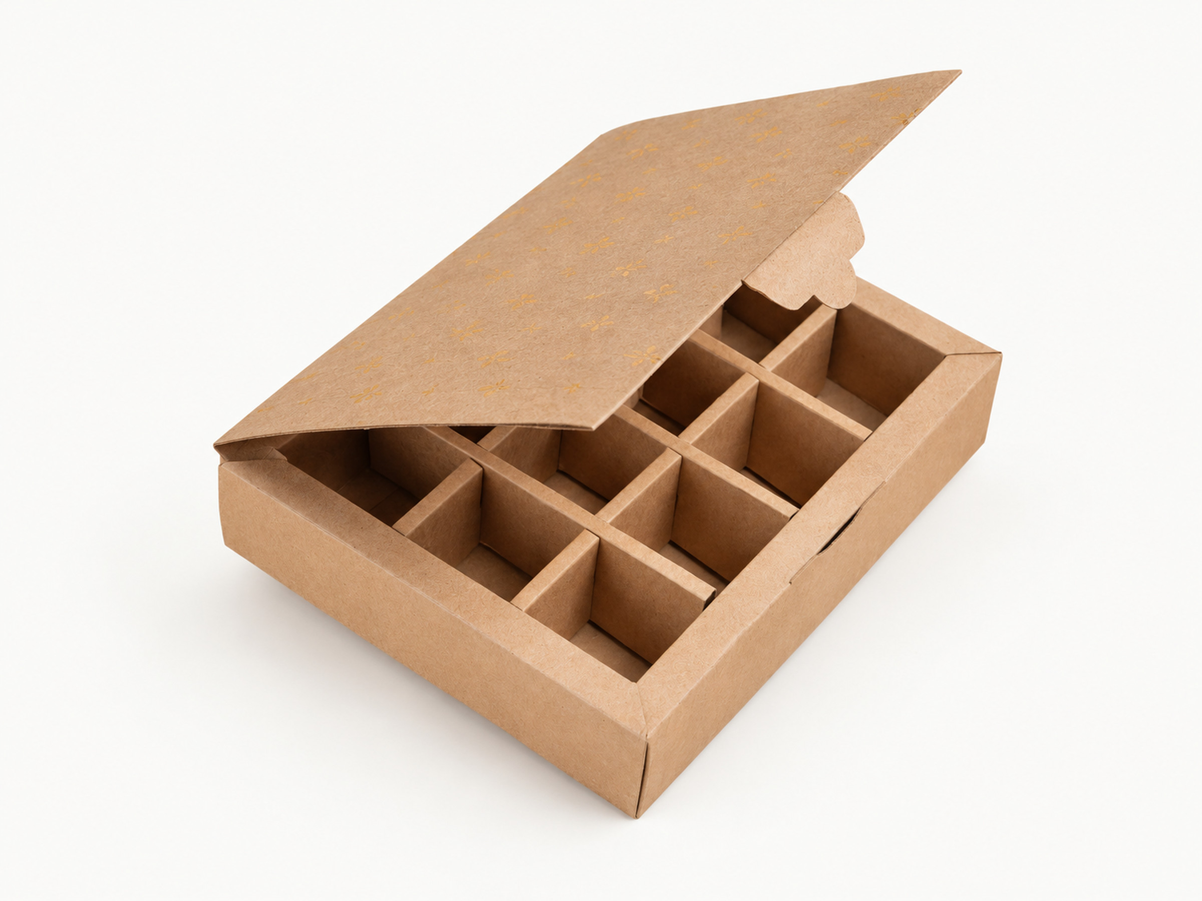 Partly open kraft gift box with small gold lid motifs and a nine-compartment divider insert.